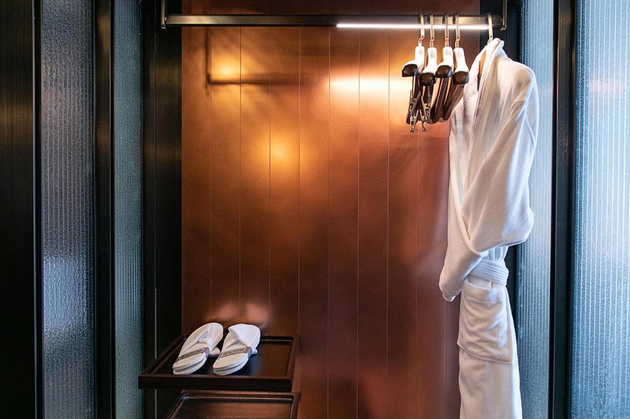 Mumian Beijing Daxing International Airport, Part Of Hyatt Hotel Exterior photo A bathrobe and slippers in a hotel room